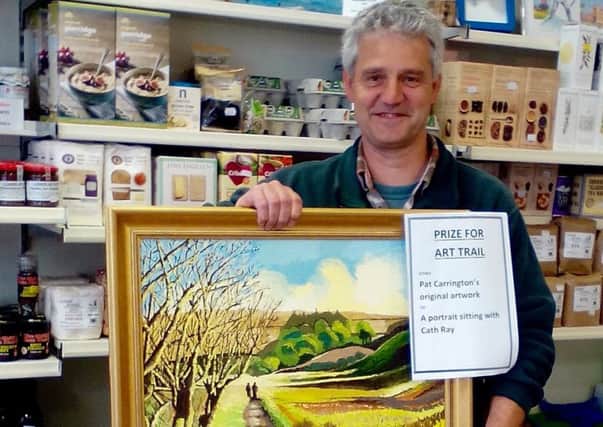 Dominic Schad with his prize from the Retford Arts Festival Trail