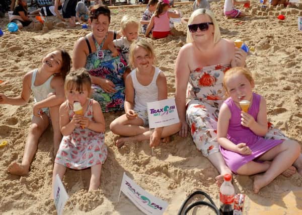 The seaside comes to Worksop, pictured are Melody Warnes, six, Keisha Fox, six, Layton Fox, one, Laci-Mae Revelle, seven and Ryah Revelle, four with Hayley Warnes and Kadie Fox