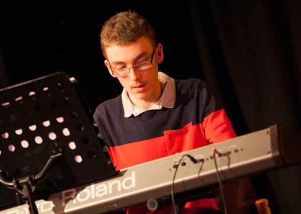 DRONFIELD pianist Robert Wolstenholme raised more than Â£500 for the National Autistic Society when he entertained shoppers at Crystal Peaks shopping mall with over five hours of music.