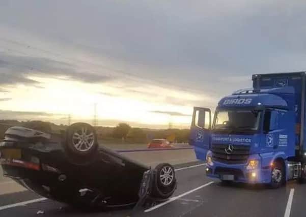 The aftermath of the crash on the M1 in which a woman was left dangling upside down in her car. (Photo: Darren DeMarco).