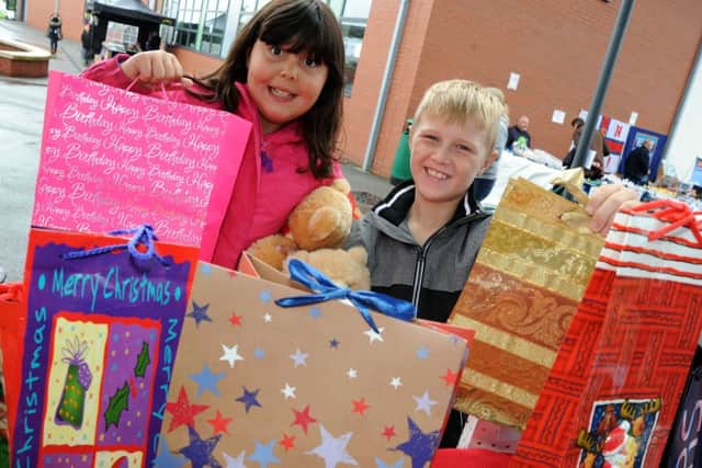 Clowne Gala. Sarah Jackson and Keane Bartley try their luck on the Clowne Community Association's Â£1 Bag Surprise stall.