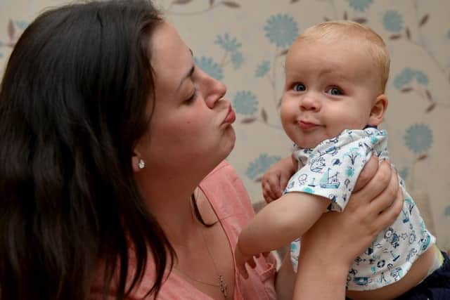 Alison Grocock is raising awareness of meningitis after A&E staff failed to diagnose her baby son with the disease. Alison is pictured with John