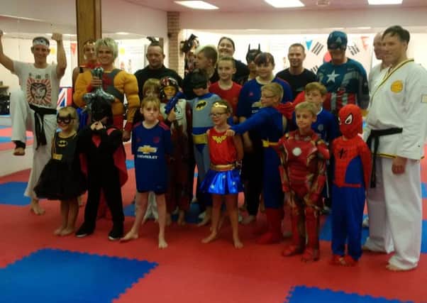 Members of the Lynx Academy dressed as superheroes for training to help support the Mayor of Retford's charity