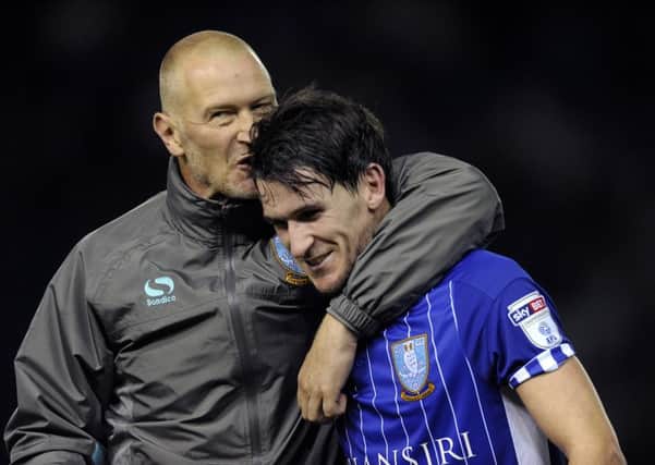 Happy Kieran Lee, right, gets a kiss off Lee Bullen after his winner against Bristol City