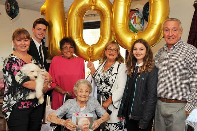 One hundred year old Eileen Hicking is surrounded by her family during her birthday celebration at the Victoria Care Home in Worksop on Tuesday. From left, are grandaughter Louise Sutton, great grandson Jude Sutton, daughters Elaine Henderson and Mal Richardson, great grandaughter Madeleine Sutton and Colin Barratt.