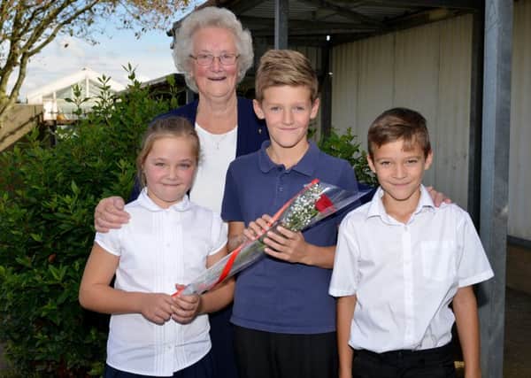 Guardian Rose presentation to Spencer Presho, 10 who helped a school friend when she had an accident. Spencer is pictured receiving his rose from Kacey Clarkson, 10 watched by his Nan Slyvia Middleton who nomiated Spencer and KaceyÃ¢Â¬"s twin brother Kallum Clarkson, 10