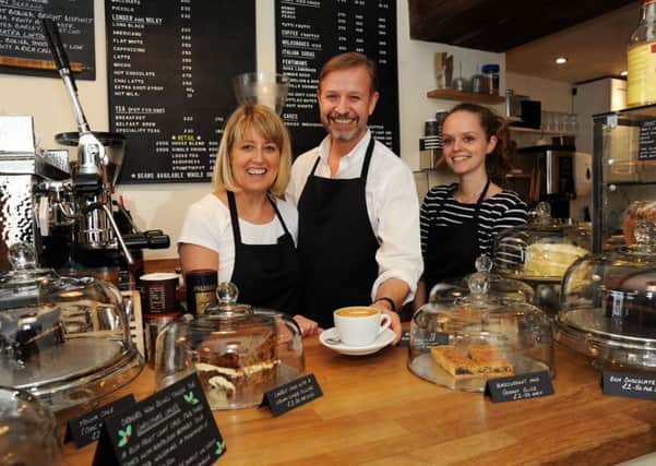 Gail and Tony Brammer with Kyra Lacey in Piccolo's Coffee Shop on Bridge Street, Worksop.