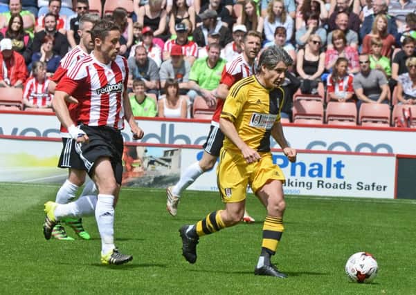 Michael Brown (left) takes part in a Sheffield United Legends match with Paul Peschisolido