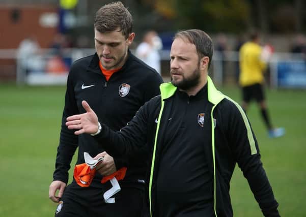 Kyle Jordan pictured with Worksop Town manager Mark Shaw during Saturday's match between Tigers and Rainworth. Picture by Mark Fear.