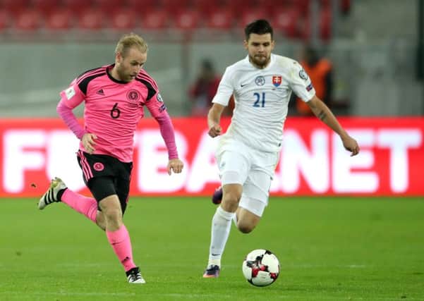 Scotland's Barry Bannan (left) and Slovakia's Michal Duris (right) battle for the ball during the 2018 FIFA World Cup Qualifying match at the City Arena, Trnava. PRESS ASSOCIATION Photo. Picture date: Tuesday October 11, 2016. See PA story SOCCER Slovakia. Photo credit should read: Nick Potts/PA Wire. RESTRICTIONS: Use subject to restrictions. Editorial use only. Commercial use only with prior written consent of the Scottish FA. Call +44 (0)1158 447447 for further information.