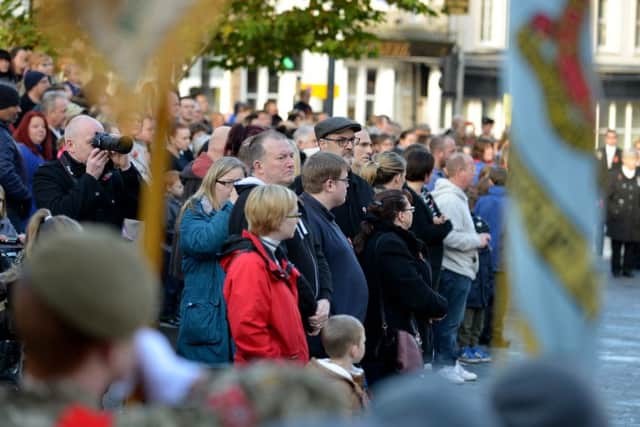 Crowds gather and wait for the parade to begin in Old Market Square.