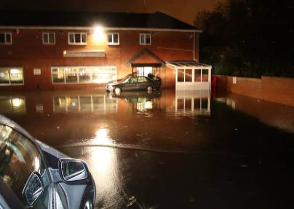 ENGULFED -- the scene outside the flooded Stanley Street Sports and Social Club in Worksop on Monday evening.