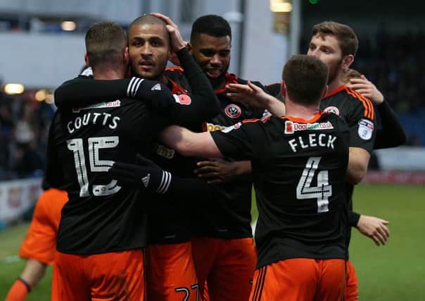 Leon Clarke (second left) and Ethan Ebanks-Landell (third left( are close on and off the pitch. Pic Simon Bellis/Sportimage
