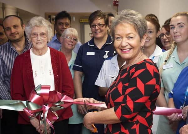 Dame Rosie Winterton MP is pictured cutting the ribbon at the opening.