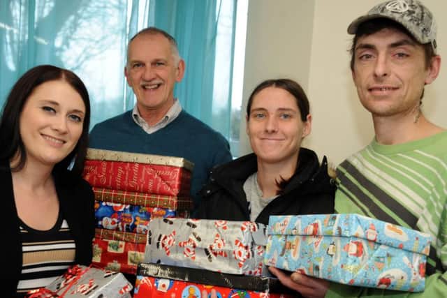 Development worker, Emma Longmore, Chief Executive Officer, Alan Diggles and Kerriann and Dean Lewis with some of the shoe boxes that have been donated to Hope.