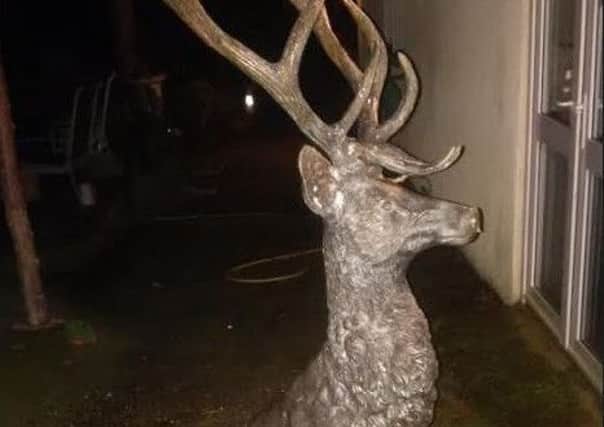The deer statue is similar to the one pictured although it doesn't have antlers.