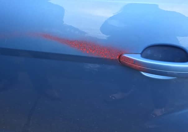 Nurse Laura Jordan's car was spray-painted red.
