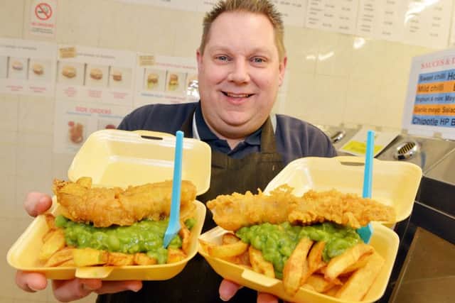 Chip Inn owner Tim Moncaster with buy one get one free offer.