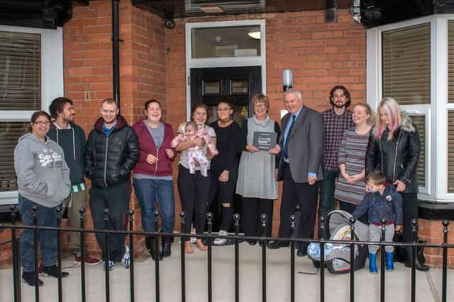Outside the refurbished flats on Overend Road.