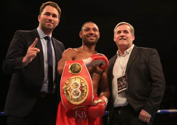 Kell Brook celebrates victory with Eddie Hearn and his dad Terry
