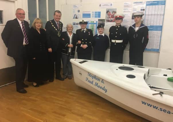 Cadets and District Council officials with the donated sailing craft.