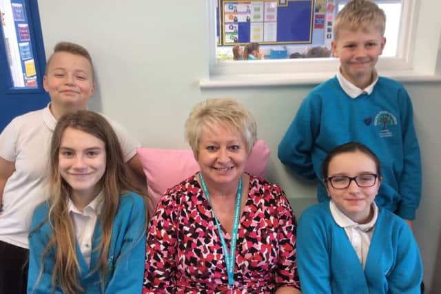 Jackie Neal (centre) is pictured with members of the school council, Leo Marshall, Sophie Turner-Guest, Ben Walsh and Aleasha Rose Glen