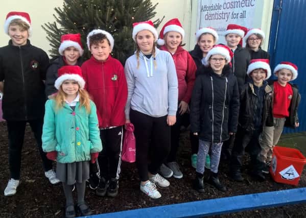 Pupils from Parish Church Primary School performed Christmas songs for Trinity fans