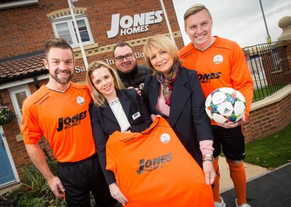 Kelly and Dinah from Jones Homes with members of Harworth Colliery FC; James Woodward, Jonathon Wilson and Ryan Paczkowski.