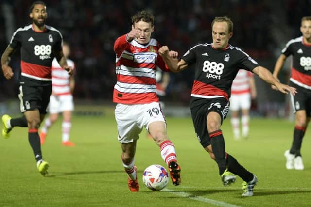 Liam Mandeville and David Vaughan challenge for the ball.
Doncaster Rovers v Nottingham Forest. EFL Cup 1st round. 9 August 2016. Picture Bruce Rollinson