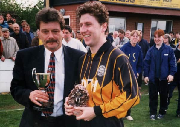 Rick Knowles pictured during his Worksop Town days presenting an award to Dave McNicholas.