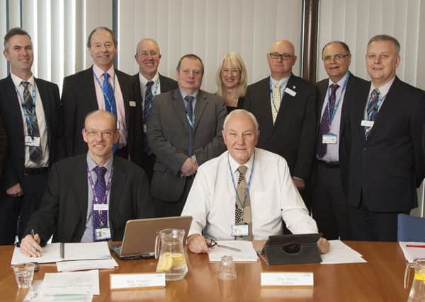 Pictured is Chris Scholey (centred right) with the Board of Directors.