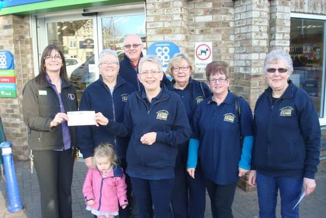 A cheque was presented by a representative from Morton Co-op for £1,082.32 with a few Gainsborough Heritage Centre volunteers in attendance