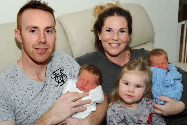 Claire Hawksworth with Jake, and dad, John Storey with Jack, their New Year's Day arrivals who are pictured with their little sister Ella.