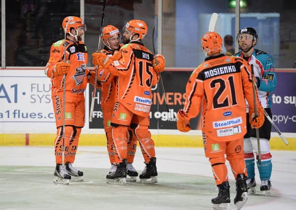 Sheffield Steelers - then with Tyler Mosienko and Jesse Schultz in the side - celebrate after scoring against Belfast. Pic Dean Woolley