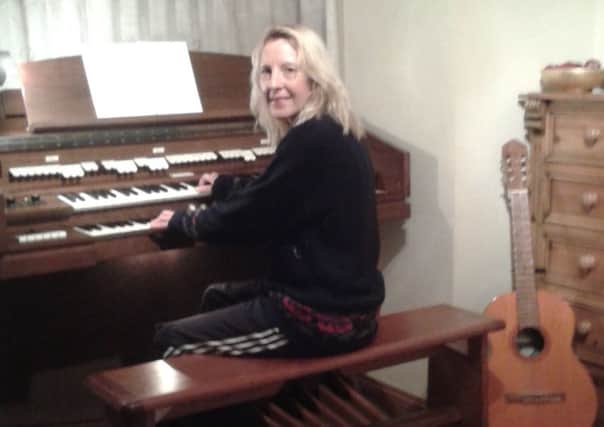 Fiona Law with the church organ she brough back from Port Talbot
