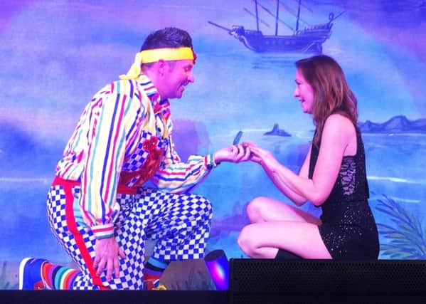Adam, in costume as Smee, proposes to Karen Tomkins on stage at Mansfield's Palace Theatre during a performance of Peter Pan.