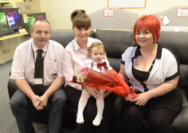 Staff members Neil Armstrong and Natalie Smith at Brighthouse, Worksop receive the Guardian Rose from Sianna Askew and mum Molly Harrison

Picture: Sarah Washbourn / www.yellowbellyphotos.com