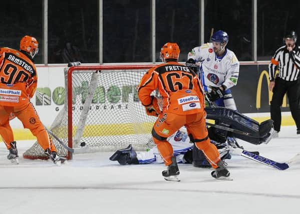Colton Fretter and John Armstrong in goal action for Steelers