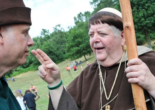 Robin Hood Festival launched.  
Bless you my son! Friar Tuck, aka, Phil Rose from TV's Robin of Sherwood, gives Chad's Kev Rogers a blessing at the opening ceremony on Monday.