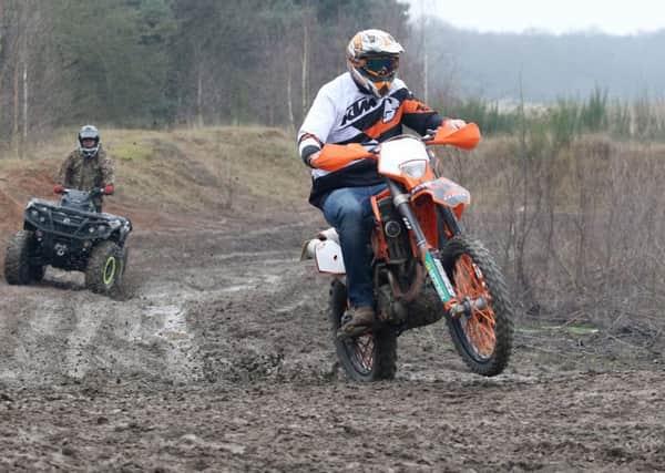 Bikers protest at Manton Pit Top, riders on the circuit