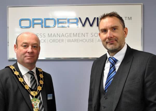 West Lindsey District Council Chairman Roger Patterson with David Hallam, Director at OrderWise at the company's Saxilby headquarters.