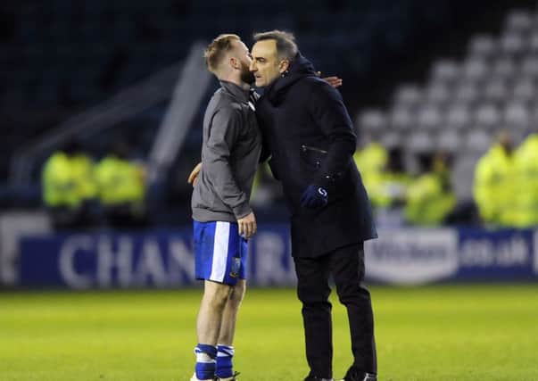 Owls Barry Bannan embraces Carlos Carvalhal at the final whistle