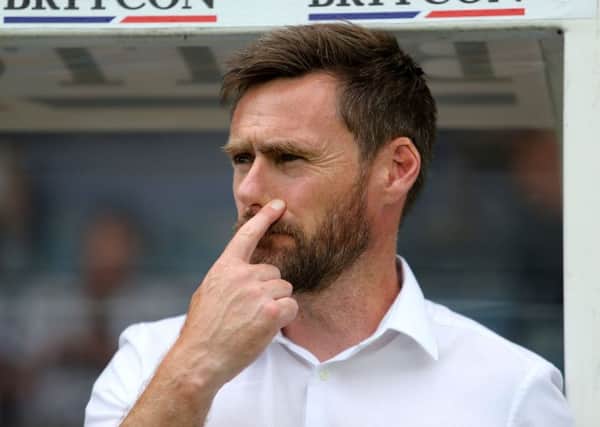 Scunthorpe United's manager Graham Alexander brings his team to Bramall Lane today