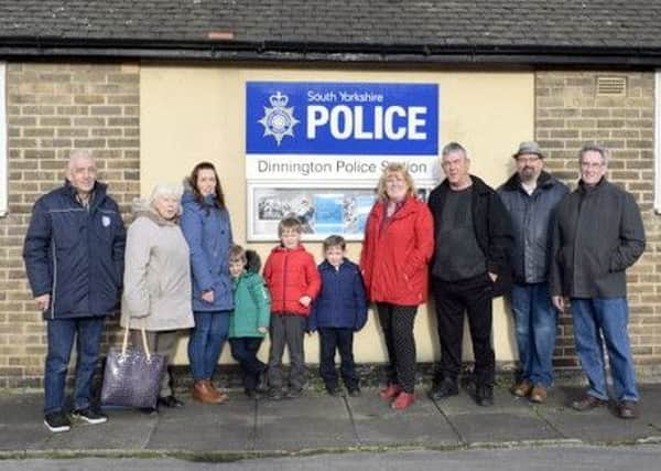 Tim Wells and fellow campaigners outside the closed and boarded-up Dinnington police station.