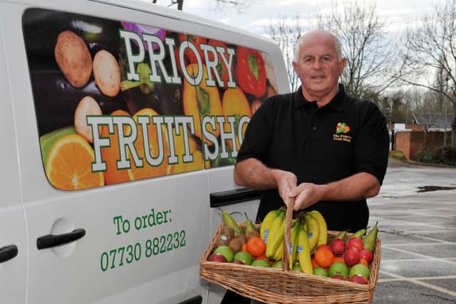 Guardian Freebie, free bag of Braeburn apples from The Priory Fruit Shop. The shop now offers delivery service, pictured is owner Steve with the office basket