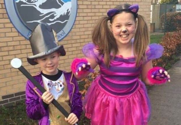 Jack Craik, aged 9, and Millie Craik, aged ten, from Sir Edmund Hillary school, as the Mad Hatter and the Cheshire Cat.