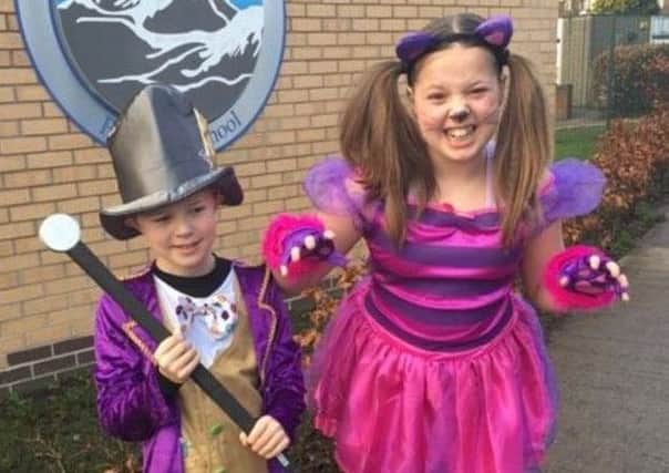 Jack Craik, aged 9, and Millie Craik, aged ten, from Sir Edmund Hillary school, as the Mad Hatter and the Cheshire Cat.