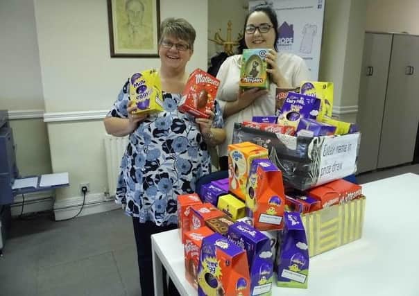 HOPE staff members Joanne Linley (left) and Charley Robinson with some of the Easter eggs donated by North Notts College