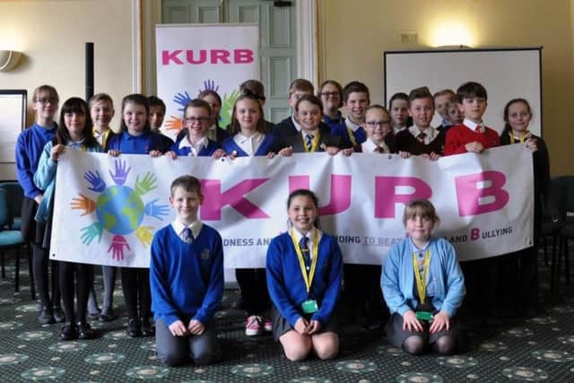 Members of the Worksop Junior Council proudly display their KURB banner.