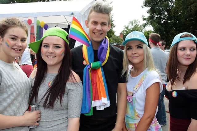 Visitors enjoy last year's Gay Pride celebrations.